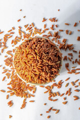 red integral rice on glass bowl isolated on white background in Brazil