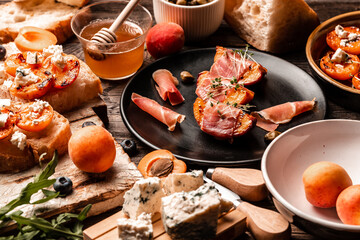 appetizer with grilled peach, ham and dor blue cheese, Food recipe background. Close up