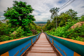 The background of a bridge or a walkway to admire the mountain scenery resembles a Phaya Naga mortgage statue, (Wat Phra Bat Phu Pan Kham) in Khon Kaen Province, Thailand.