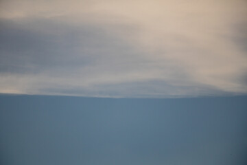 Beautiful sky and clouds in soft color.Soft  cloud in the sky background blue tone.