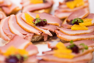 Naklejka na ściany i meble prosciutto and ham canapés nicely presented for a catering function 