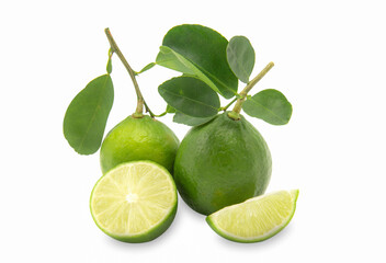 A fresh green lime and a piece of slice lime