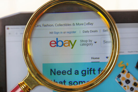 a search engine for product search around the world "Ebay.com", close-up under a magnifying loupe, Websites that sell auction online Market Place.