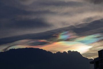 Beautiful Iridescent Pileus cloud in the evening.Rainbow cloud background.	
