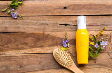 hair care serum for damaged hairs with comb health care beauty head and hairs of lifestyle woman arrangement flat lay style on background wooden