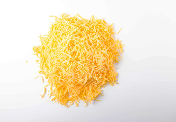 Grated hard cheese on a white plate. Russian cheese, Dutch, parmesan heap grated on a white plate in a close-up top and top view