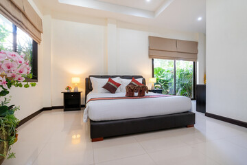 Interior design of house, home, condo and villa feature double bed, red bed runner, and dressing table in bedroom