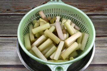 Pile of cutting fresh lotus stem (lotus root) in the plastic basket. Famous local ingredients in Asia restaurant. High fiber and cheap price menu. 