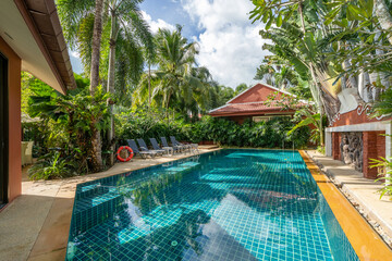 Exterior design of house, home and pool villa feature swimming pool, terrace, landscape garden and sun bed