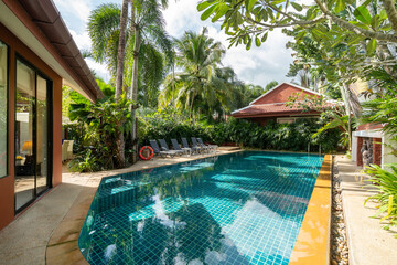 Exterior design of house, home and pool villa feature swimming pool, terrace, landscape garden and sun bed