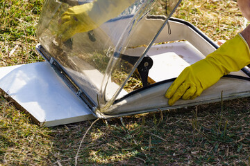 Woman cleaning old caravan sunroof