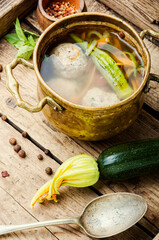 Soup with meatballs and zucchini