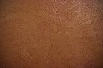 Dark brown leather texture background The concept of artificial leather used for making bags, pad and various appliances.