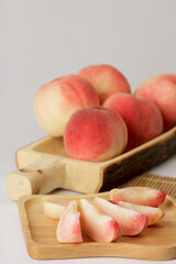 honey peach in wooden bowl