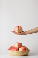 honey peach in wooden bowl