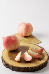 honey peach in wooden bowl