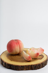 honey peach in wooden bowl