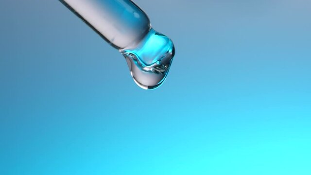 Water dropper in slow motion on blue background