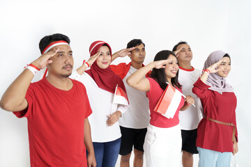 group of indonesian people on flag ceremony giving salute. indonesia independence day