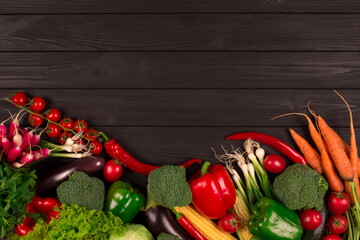 Fresh farm raw vegetables from local farmer market, on black wooden background or table. Healthy and organic food concept, autumn harvest. Copyspace for your text or presentation, blog