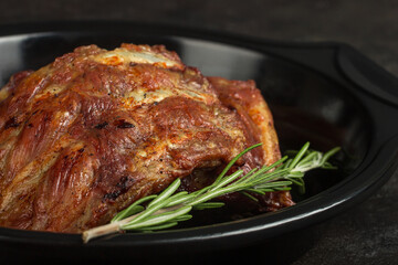 Roasted pork ribs with rosemary closeup