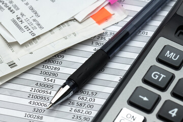 cash registers purchase receipt written on russian language, calculator and financial reports, analysis and accounting, various office items for bookkeeping