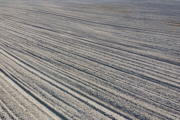 Plowed agricultural field, aerial view. Agricultural land. Background.