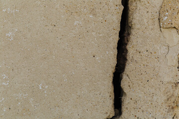 Large crack in the wall of the house. Closeup, cracked, damage.