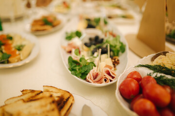 Table with food and drink on wedding. Served and decorated table in restaurant