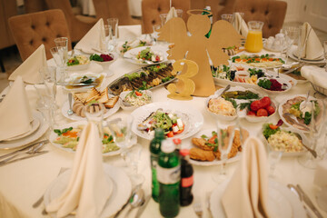 Table with food and drink on wedding. Served and decorated table in restaurant