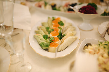Table with food and drink on wedding. Served and decorated table in restaurant