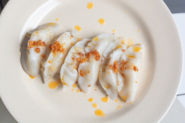 choipan in a plate with fried garlic toping, traditional food from west kalimantan 
