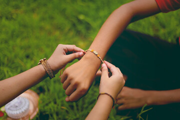 brother and sister hands  celebrating raksha bandhan festival 