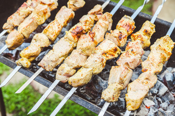 Meat grilling on the brazier. Selective focus.