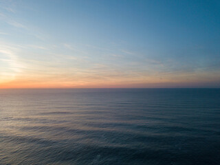 Sunrise view over the ocean horizon.