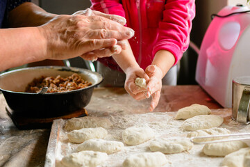 little grandmother's granddaughter learns to cook, sculpt dumplings