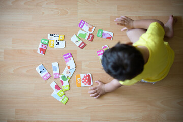 young boy playing at home with puzzle