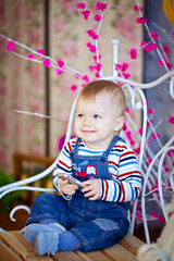 baby boy sitting with mobile phone