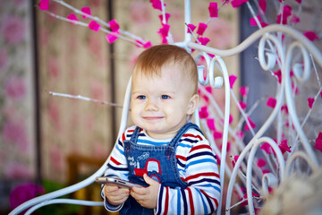 little boy playing with a mobile phone