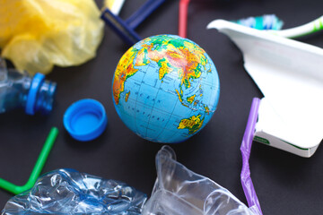 Globe and plastic trash. Global problem of ecology, pollution of planet. Human and Earth