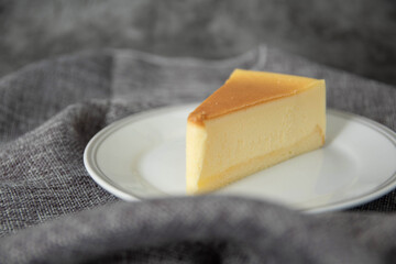 Place cheesecake on a white plate.