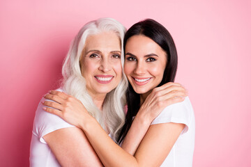 Photo of charming aged mother young pretty daughter two ladies good mood hugging best friends...