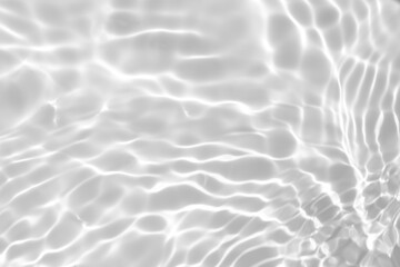 Fototapeta na wymiar Closeup of desaturated transparent clear calm water surface texture with splashes and bubbles. Trendy abstract nature background. White-grey water waves in sunlight