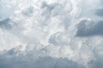 White fluffy clouds on cloudy sky. Soft touch feeling like cotton. White puffy cloudscape. Beauty in nature. Close-up white clouds texture background. Pure nature. White background for minimal pattern