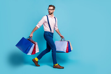 Full body profile photo of handsome business man carry many bags buy clothes vacation shopping...