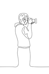 Silhouette of a male photographer / journalist / private detective with a professional camera who takes or takes a photo. Vector illustration can be used for animation