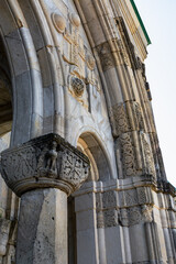 Columns of the temple of Bagrat, decorated with ornamental carvings. Rough textured surface of the...