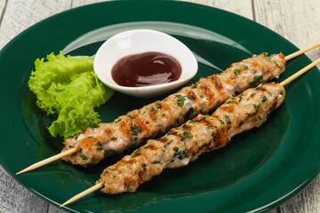 Minced pork skewer kebab with sauce