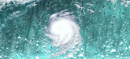 Cyclone behind wet rainy window.  The eye of the hurricane. Typhoons and tropical storms season...