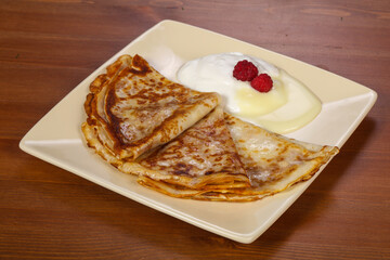 Pancakes with sour cream and condenced milk